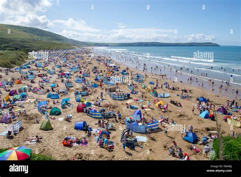 Busy Woolacombe beach in the summer season voted best UK beach for a ...