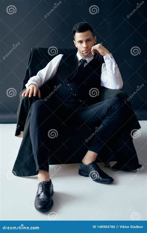 Confident Thoughtful Man in Elegant Suit Posing Sitting in Chair Stock Photo - Image of dream ...