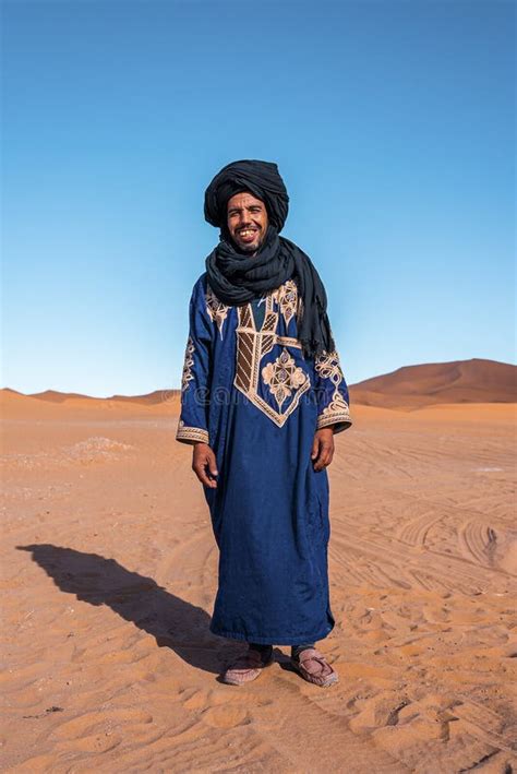 Bedouin Man Wears Traditional Clothes while Standing in Desert Against ...