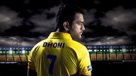 Backside Of MS Dhoni Is Wearing Yellow Sports Dress Black White Clouds ...