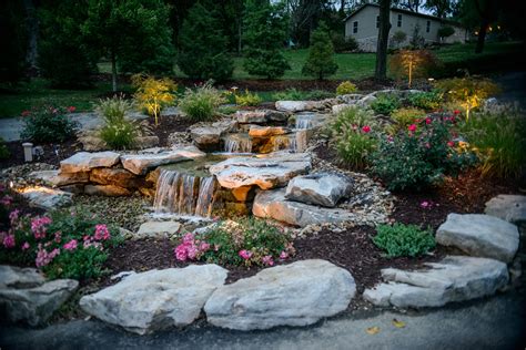 Landscaping around a waterfall is absolutely gorgeous! | Waterfalls backyard, Waterfall ...