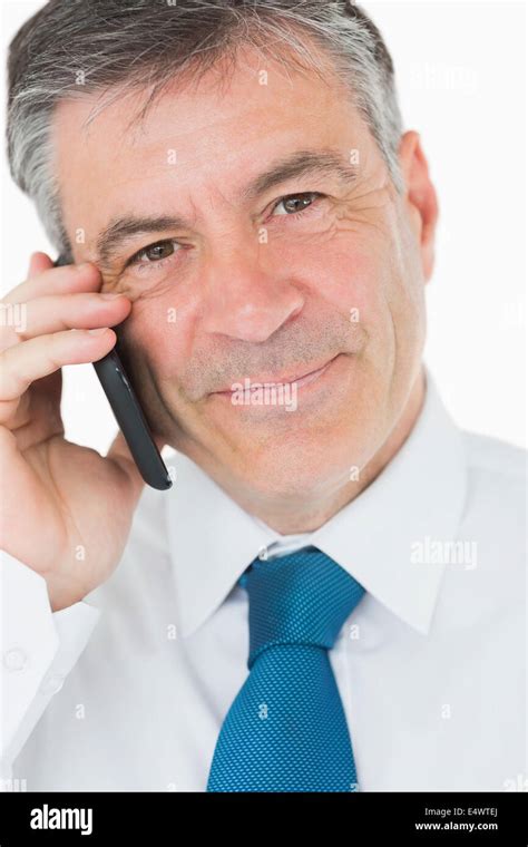 Happy man on mobile phone Stock Photo - Alamy