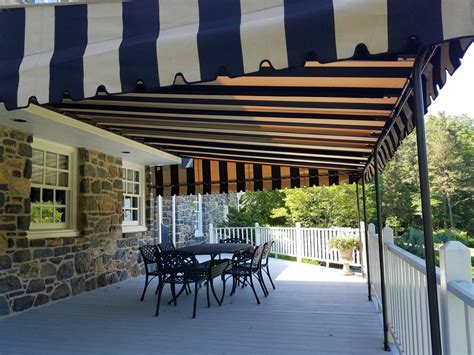 Fixed awning installed on a stone home | Kreider's Canvas Service, Inc.