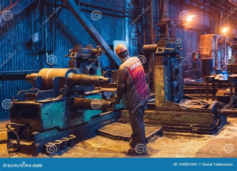 Heavy Industry Worker Working Machine. Rough Industrial Environment ...