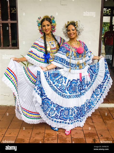 Two Panamanian women wearing the colorful traditional pollera, the ...