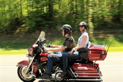 Couple riding motorcycle stock image. Image of their - 43691145