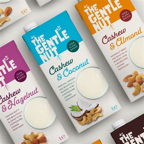 six cartons of the gentle nut milk are lined up on a white table top