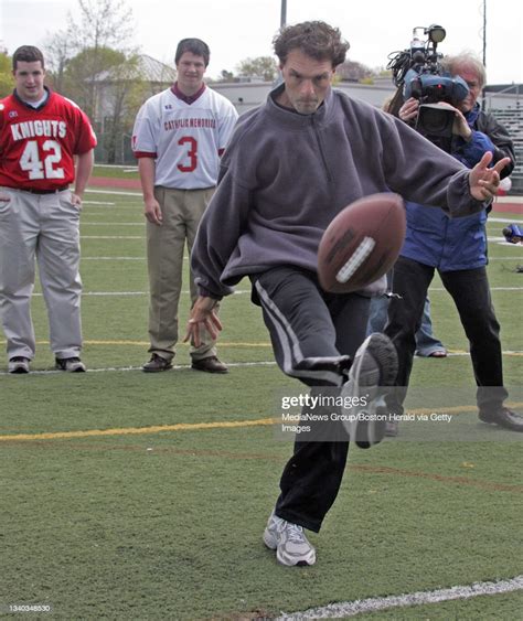 Doug Flutie practice drop kick with kickers Chris Rooney and Mike ...