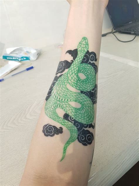 Dream of a snake in 2022 | Snake tattoo design, Green tattoos, Floral tattoo sleeve