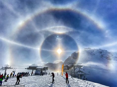 Skiing photographer captures stunning 'ice halo' around the sun over the Swiss Alps | Daily Mail ...