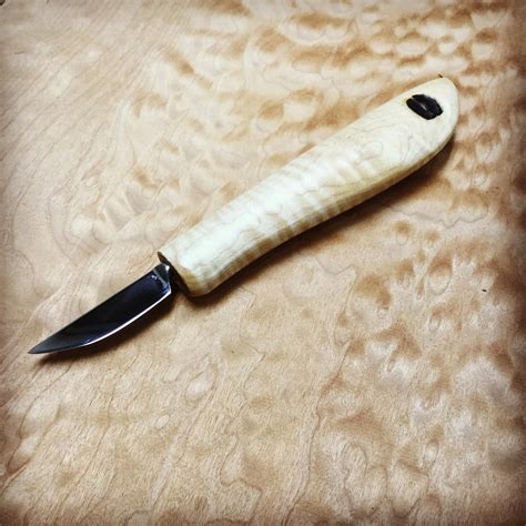 Tiger maple handle on with a 1-3/4 inch general carver blade. This knife is a great knife for ...