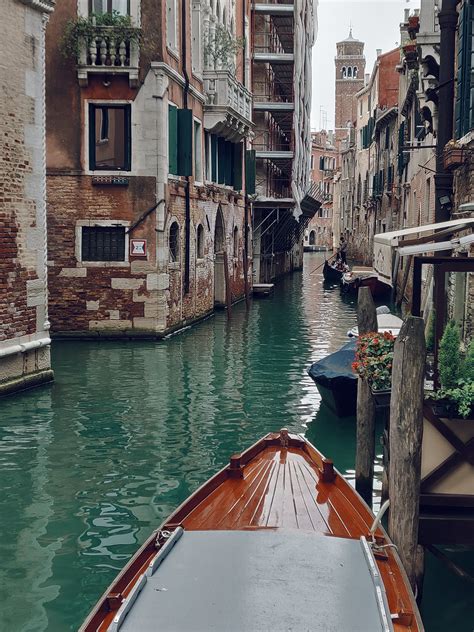 Brown Boat Along The Canals Of Venice · Free Stock Photo