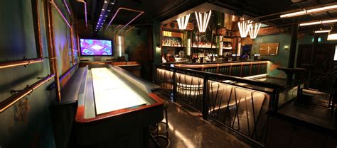 Electric Shuffle | A New Tabletop Shuffleboard Bar From Flight Club