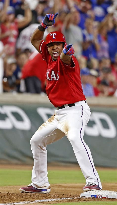 Texas Rangers shortstop Elvis Andrus celebrates after hitting a three-run triple against Boston ...