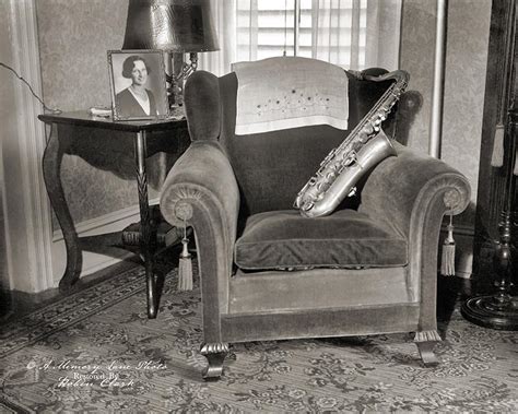 This photo is filled with symbolism for me. An empty chair with a saxophone on it and the ...