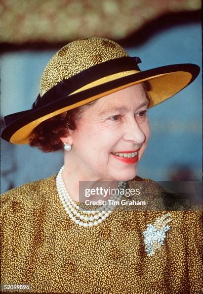 The Queen Smiling In Kuala Lumpur. She Is Wearing A Hat By Philip ...