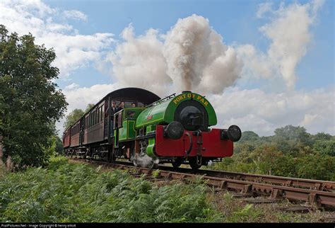 This is unusual low four-wheel saddle tank railway steam locomotive. built by W.G. Bagnall for ...