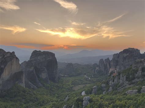 Meteora, Greece: unfiltered sunset views of the monasteries built on top of rocks, good for ...