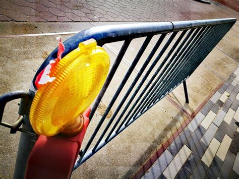 Premium Photo | Close-up of metal barricade on road