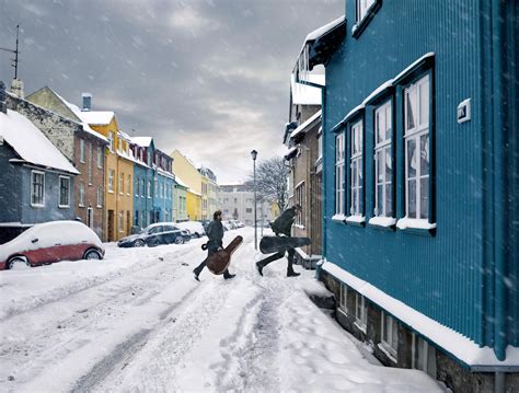 Winter in downtown Reykjavík, Iceland, makes the houses shine bright in the snow. We scoot ...