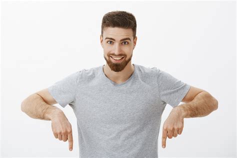 Waist-up shot of excited and confident charming brunet man with beard ...