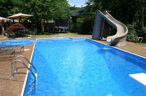 Pool, complete with slide and diving board. | Backyard pool, Pools backyard inground, Backyard