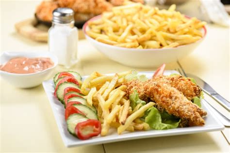 Chicken strips and fries stock image. Image of plate - 134524695