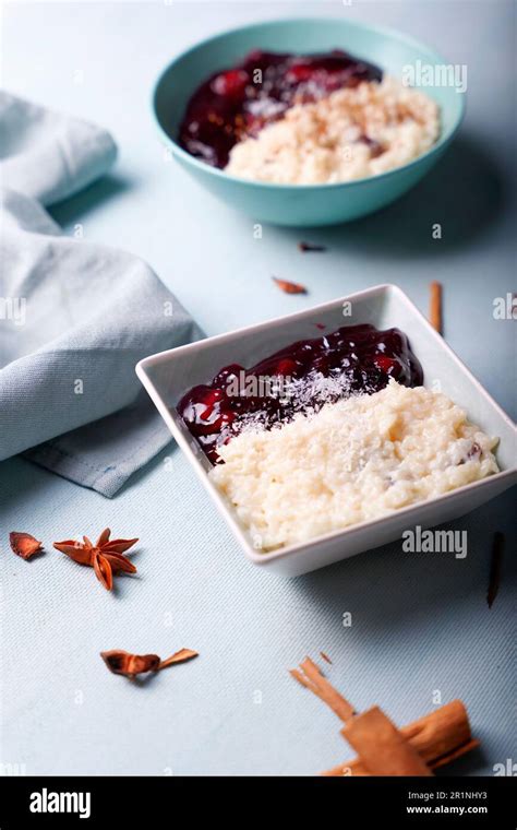 A typical Peruvian dessert with rice pudding and purple mazamorra Stock ...