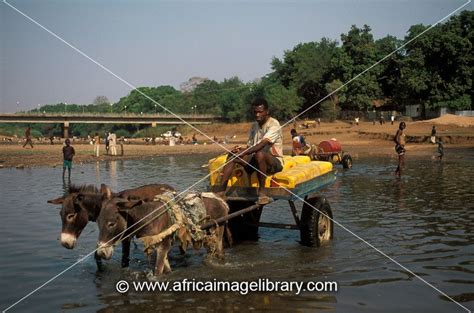 Photos and pictures of: People collecting water from the Baro river, Gambela, Ethiopia | The ...