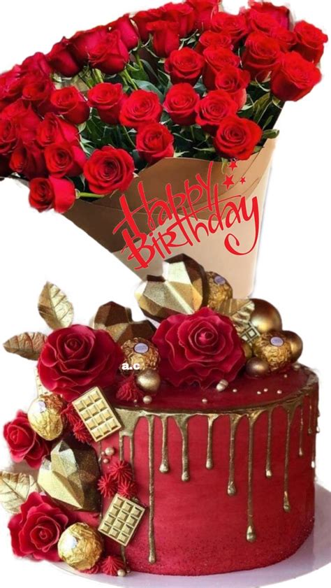 a birthday cake with red roses and chocolates on the top that says happy birthday