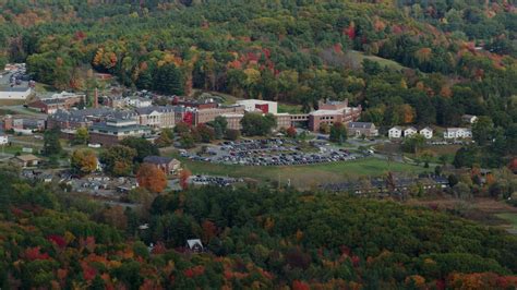 5.5K stock footage aerial video flying by White River Junction VA Medical Center, autumn, White ...