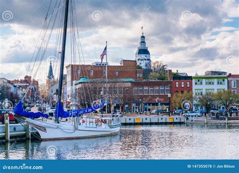 Boat in Annapolis Harbor and the Maryland State House in Annapolis ...