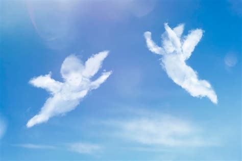 Premium Photo | Angels flying in the sky Cloud figures of angels