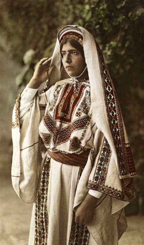 Palestine | 'A bride wears traditional costume with embroidered cloth and a veil'. 1910s ...