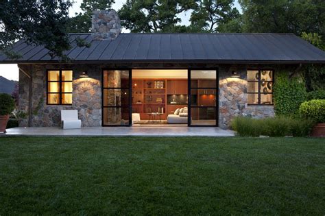 Fieldstone Guest Cottage, Sonoma, CA. Exterior Stone Façade, Metal Roof, Modern Steel Sliding ...