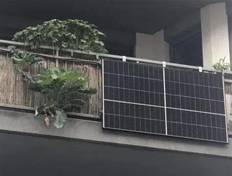 Man installs solar panel on apartment balcony to save on energy bills ...