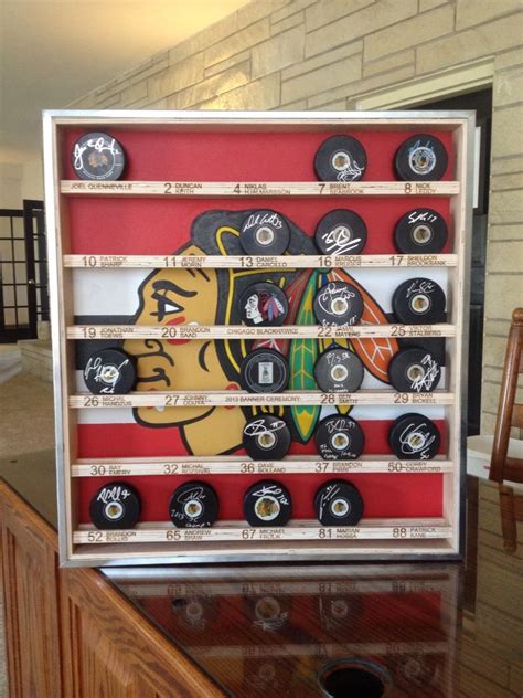 Custom hockey puck display case for the '13 Stanley Cup Blackhawks team Come see our SPORTS ...