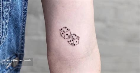 Dice tattoo located on the inner arm, minimalistic