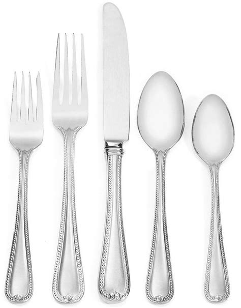 an assortment of silverware including forks, spoons and knives on a white background