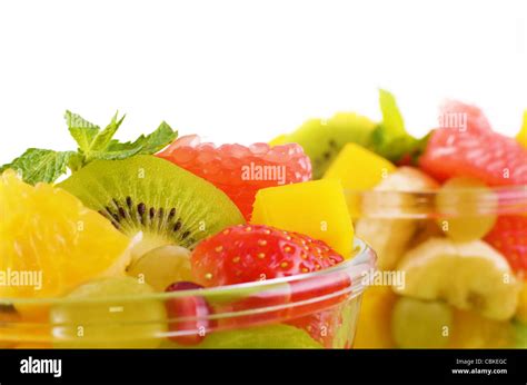 Healthy fruit salad over white background closeup Stock Photo - Alamy