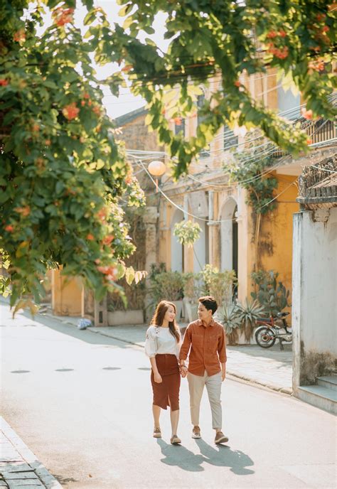 A Couple Holding Hands while Walking · Free Stock Photo