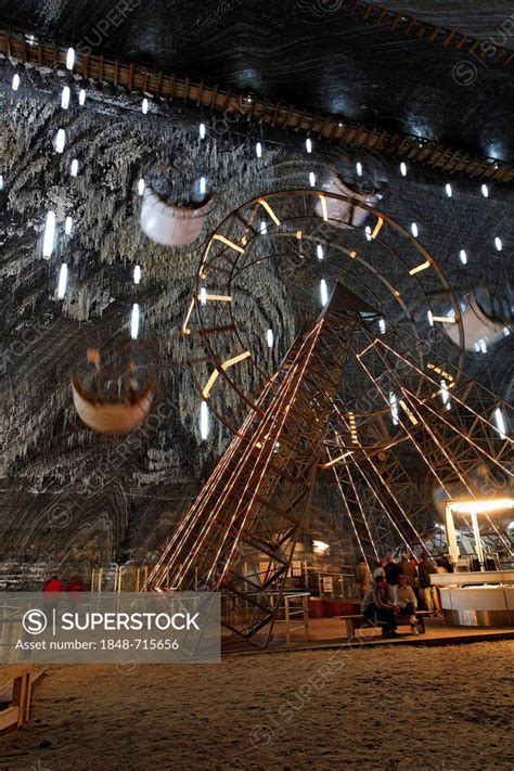 Amusement park, ferris wheel in Salina Turda salt mine in the Mina Rudolf, Turda, Thorenburg ...