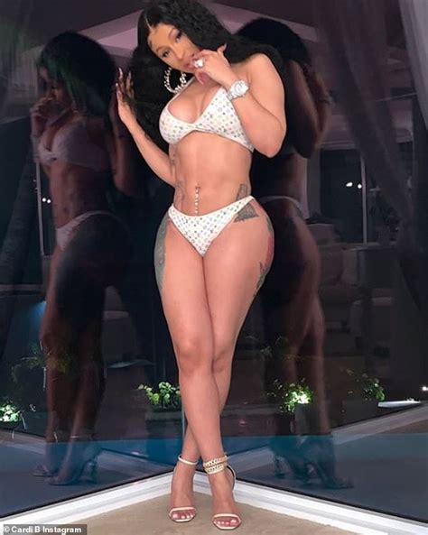 Cardi B flaunts hourglass figure in a daring thong bikini before planting a kiss on husband ...