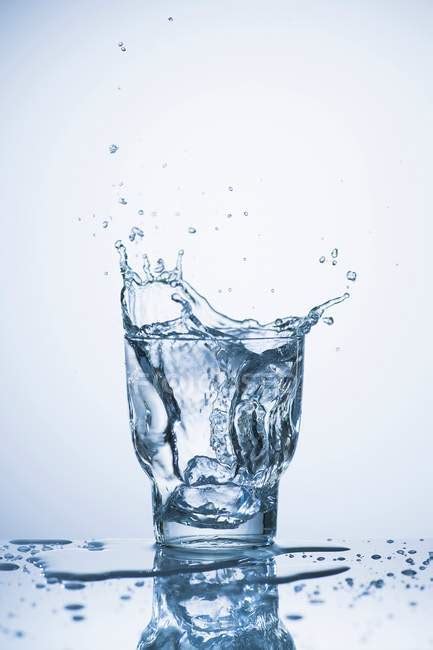 Water splashing into a glass — close, up - Stock Photo | #154982366