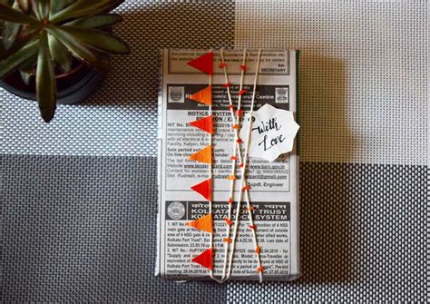 DIY NEWSPAPER GIFT WRAP - OoshyBooshy