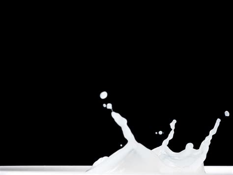 Milk Splash on black background. 10717738 Stock Photo at Vecteezy