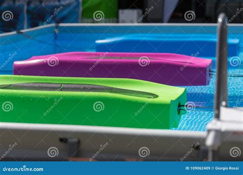 Colorful Floating Fitness Mat in an Outdoor Swimming Pool Stock Image - Image of workout, active ...