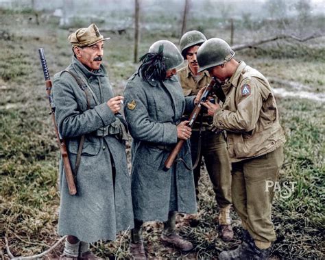 Newfound Allies- Two GIs of 36th Infantry Division, Fifth Army, inspect the Beretta Model 38 ...