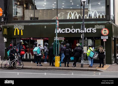 Delivery riders waiting outside McDonald’s in Tooting, South London ...