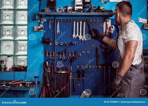 Car mechanic and his tools stock photo. Image of maintenance - 67152804